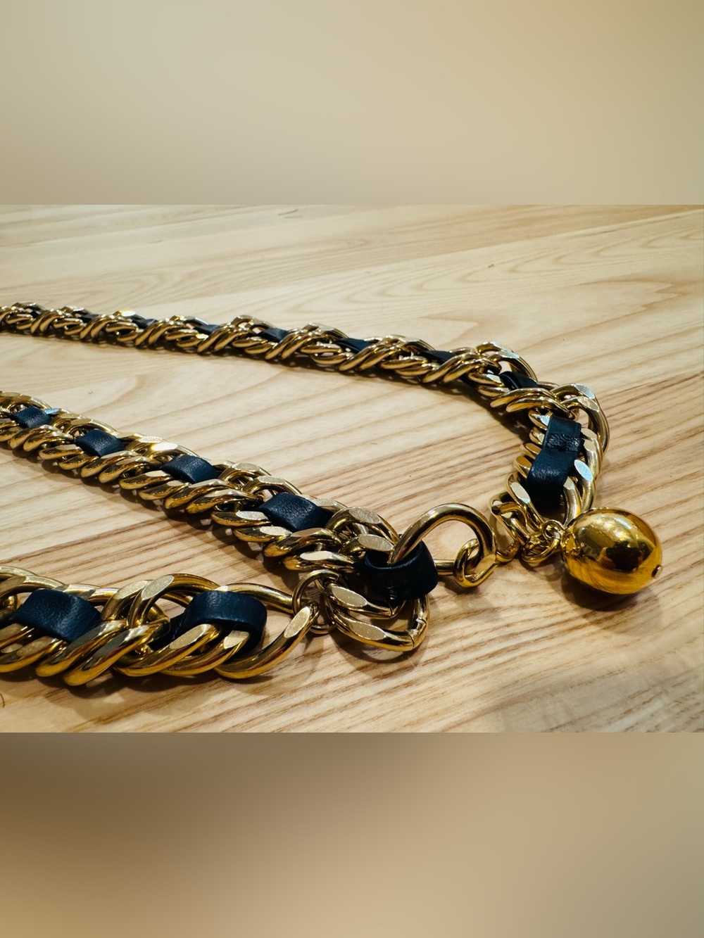 Possible Chanel gold chain and leather woven belt